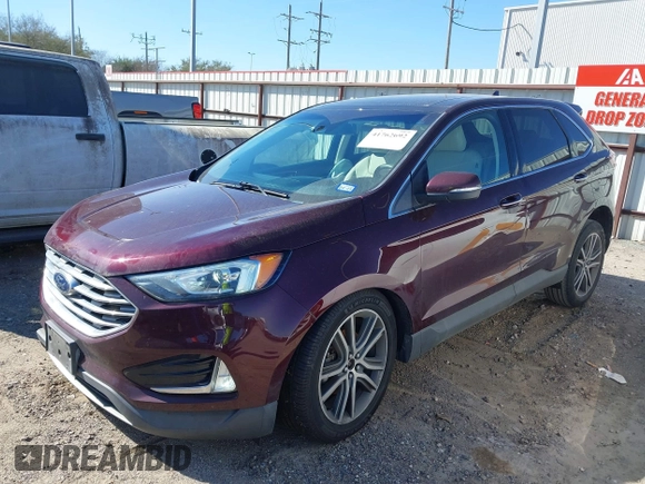 2019 Ford Edge Titanium z VIN 2FMPK3K94KBB41673, wystawiony jako IAAI lot #41762692 z przebiegiem 82 812 mil mil oraz . Historia ofert i sprzedaży dostępna na DreamBid. Obrazek 2.