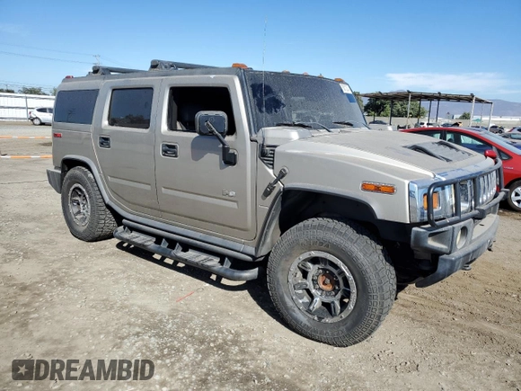 2005 Hummer H2 SUV with VIN 5GRGN23U85H113194, listed as a Copart auction lot 78012304 with 148,940 mi miles and Salvage Title. Bid and sale history available at carsss.com. Image 4.