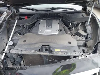 2014 Infiniti QX70 z VIN JN8CS1MW6EM410091, wystawiony jako IAAI lot #41896327 z przebiegiem 139 021 mil mil oraz . Historia ofert i sprzedaży dostępna na DreamBid. Obrazek 10.