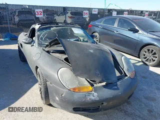 1998 Porsche Boxster z VIN WP0CA2982WU621935, wystawiony jako IAAI lot #41838363 z przebiegiem Nie podano mil oraz . Historia ofert i sprzedaży dostępna na DreamBid. Obrazek 6.