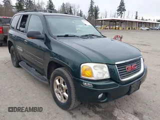 2002 GMC Envoy SLT with VIN 1GKDS13S822302873, listed as a IAAI auction lot 41637428 with 133,697 mi miles. Bid and sale history available at carsss.com. Image 1.