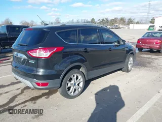 2015 Ford Escape Titanium with VIN 1FMCU0JX8FUC34459, listed as a IAAI auction lot 41394012 with 154,077 mi miles. Bid and sale history available at carsss.com. Image 4.