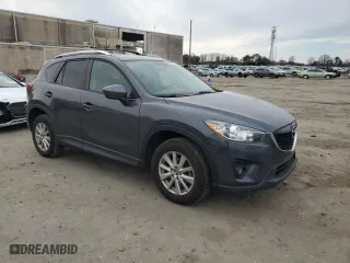 2014 Mazda CX-5 Touring with VIN JM3KE2CY0E0423991, listed as a Copart auction lot 45611695 with 121,474 mi miles and Salvage Title. Bid and sale history available at carsss.com. Image 4.