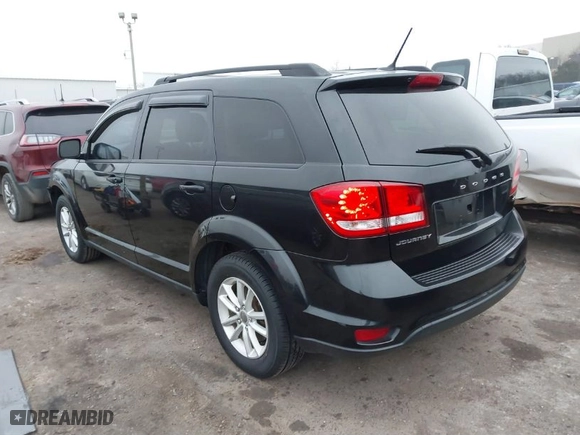 2013 Dodge Journey SXT with VIN 3C4PDCBB1DT565028, listed as a IAAI auction lot 41483127 with 129,997 mi miles. Bid and sale history available at carsss.com. Image 3.