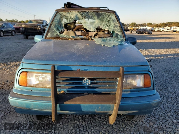 1992 Suzuki Sidekick z VIN 2S3TC01C2N6405497, wystawiony jako Copart lot #75856164 z przebiegiem 38 423 mil mil oraz Szkody całkowita. Historia ofert i sprzedaży dostępna na DreamBid. Obrazek 5.