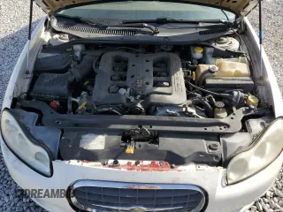 2000 Chrysler LHS z VIN 2C3HC56G4YH292405, wystawiony jako Copart lot #78263134 z przebiegiem 73 468 mil mil oraz Tytuł czysty. Historia ofert i sprzedaży dostępna na DreamBid. Obrazek 11.