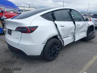 2023 Tesla Model Y Long Range with VIN 7SAYGDEE7PA023295, listed as a IAAI auction lot 41773783 with 28,079 mi miles. Bid and sale history available at carsss.com. Image 4.