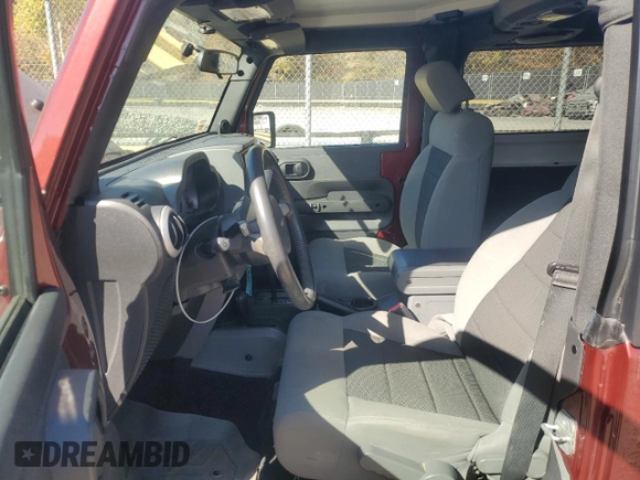 2010 Jeep Wrangler Sahara с VIN 1J4GA5D16AL225139, выставлен на аукционе Copart как лот 77114204 с пробегом Не указан миль и Списание • Salvage title. История ставок и продаж доступна на DreamBid. Изображение 7.