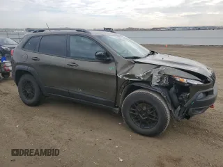 2015 Jeep Cherokee Trailhawk with VIN 1C4PJMBS0FW678738, listed as a Copart auction lot 50651235 with 147,793 mi miles and Salvage title. Bid and sale history available at DreamBid. Image 4.