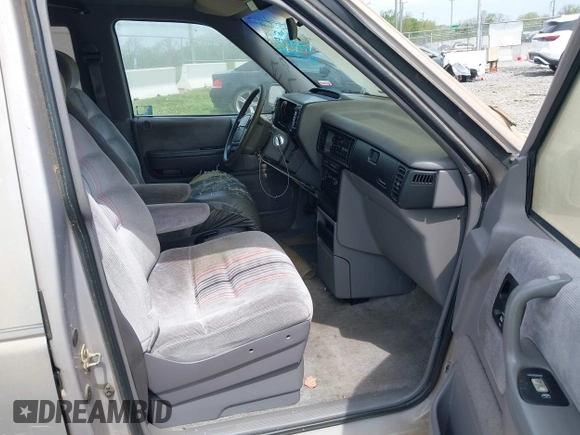 1991 Dodge Grand Caravan with VIN 1B4GK54R6MX632977, listed as a IAAI auction lot 42063934 with 130,812 mi miles and . Bid and sale history available at DreamBid. Image 5.