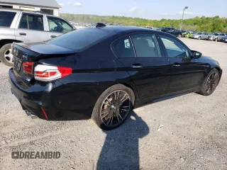 2018 BMW M5 z VIN WBSJF0C5XJB282107, wystawiony jako Copart lot #49979943 z przebiegiem 55 243 mil mil oraz . Historia ofert i sprzedaży dostępna na DreamBid. Obrazek 3.