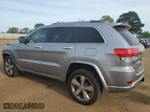2016 Jeep Grand Cherokee Overland with VIN 1C4RJFCT2GC320247, listed as a Copart auction lot 50832195 with 104,300 mi miles and Salvage title. Bid and sale history available at DreamBid. Image 2.