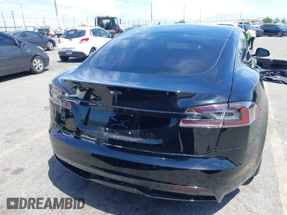 2022 Tesla Model S with VIN 5YJSA1E51NF464231, listed as a IAAI auction lot 42077838 with 53,290 mi miles and . Bid and sale history available at DreamBid. Image 17.