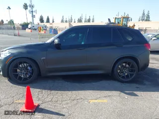 2016 BMW X5 M with VIN 5YMKT6C51G0R79331, listed as a IAAI auction lot 40590865 with 80,772 mi miles. Bid and sale history available at carsss.com. Image 14.