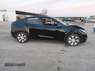 2023 Tesla Model Y Long Range z VIN 7SAYGDEE2PA166042, wystawiony jako IAAI lot #41348960 z przebiegiem Nie podano mil oraz . Historia ofert i sprzedaży dostępna na DreamBid. Obrazek 13.