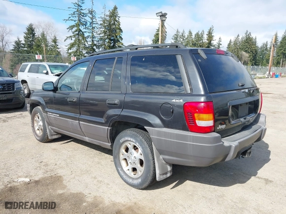 1999 Jeep Grand Cherokee Laredo with VIN 1J4GW58S6XC524451, listed as a IAAI auction lot 41741007 with 162,441 mi miles. Bid and sale history available at carsss.com. Image 3.