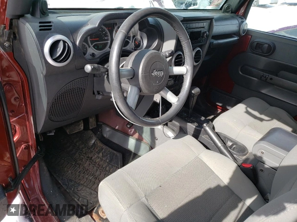 2009 Jeep Wrangler Sahara z VIN 1J4FA54159L789906, wystawiony jako Copart lot #45292375 z przebiegiem 146 992 mil mil oraz Szkoda całkowita • Salvage title. Historia ofert i sprzedaży dostępna na DreamBid. Obrazek 8.