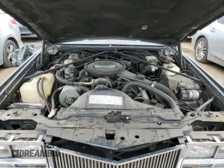 1985 Cadillac Eldorado z VIN 1G6EL5782FE634074, wystawiony jako Copart lot #44520964 z przebiegiem 74 425 mil mil oraz Szkody całkowita. Historia ofert i sprzedaży dostępna na DreamBid. Obrazek 11.