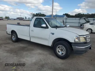1999 Ford F-150 z VIN 1FTRF17W9XNB67119, wystawiony jako Copart lot #79197414 z przebiegiem Nie podano mil oraz Szkoda całkowita • Salvage title. Historia ofert i sprzedaży dostępna na DreamBid. Obrazek 4.