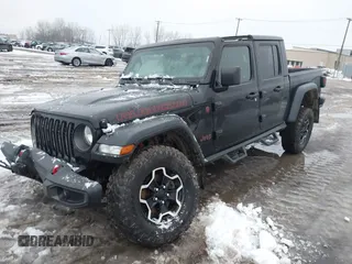 2021 Jeep Gladiator Rubicon z VIN 1C6JJTBG5ML605799, wystawiony jako IAAI lot #41190679 z przebiegiem 47 550 mil mil oraz . Historia ofert i sprzedaży dostępna na DreamBid. Obrazek 20.