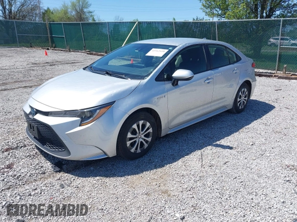 2021 Toyota Corolla Hybrid LE with VIN JTDEAMDE5MJ022110, listed as a IAAI auction lot 41912920 with 59,198 mi miles. Bid and sale history available at carsss.com. Image 2.