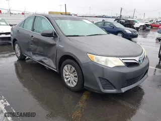 2014 Toyota Camry Hybrid LE with VIN 4T1BD1FK9EU115039, listed as a IAAI auction lot 41783409 with 143,629 mi miles. Bid and sale history available at carsss.com. Image 1.