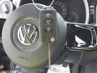 2012 Volkswagen Beetle 2.5L w/Sun/Sound/Nav PZEV with VIN 3VWHP7AT0CM623536, listed as a IAAI auction lot 41351333 with 106,600 mi miles. Bid and sale history available at carsss.com. Image 11.
