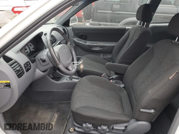 2003 Hyundai Accent GL with VIN KMHCG35C53U258469, listed as a Copart auction lot 82977294 with 99,136 mi miles and Clean Title. Bid and sale history available at carsss.com. Image 7.