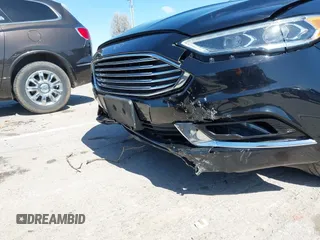 2017 Ford Fusion SE z VIN 3FA6P0HD1HR138693, wystawiony jako IAAI lot #41837634 z przebiegiem 117 638 mil mil oraz . Historia ofert i sprzedaży dostępna na DreamBid. Obrazek 6.
