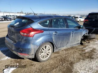 2018 Ford Focus Titanium z VIN 1FADP3N2XJL297048, wystawiony jako Copart lot #61579925 z przebiegiem 68 774 mil mil oraz Szkoda całkowita • Salvage title. Historia ofert i sprzedaży dostępna na DreamBid. Obrazek 3.