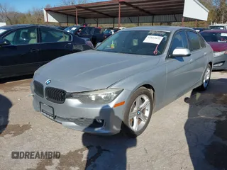 2012 BMW 3 Series 328i with VIN WBA3A5C5XCF345274, listed as a IAAI auction lot 41812072 with 142,024 mi miles. Bid and sale history available at carsss.com. Image 2.