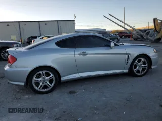 2005 Hyundai Tiburon GT z VIN KMHHN65F05U171038, wystawiony jako Copart lot #87765735 z przebiegiem 113 129 mil mil oraz Szkody całkowita. Historia ofert i sprzedaży dostępna na DreamBid. Obrazek 3.