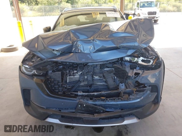 2023 Mazda CX-50 Premium Plus with VIN 7MMVABEY8PN100311, listed as a IAAI auction lot 42626276 with 40,242 mi miles and . Bid and sale history available at DreamBid. Image 6.