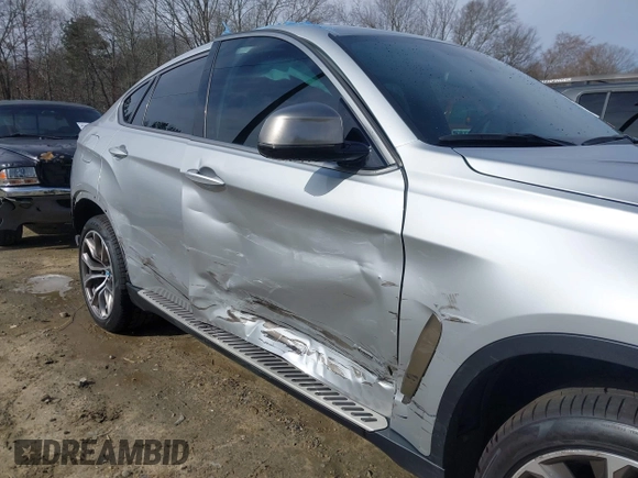 2019 BMW X6 xDrive35i z VIN 5UXKU2C52K0Z63984, wystawiony jako IAAI lot #41612265 z przebiegiem 65 634 mil mil oraz . Historia ofert i sprzedaży dostępna na DreamBid. Obrazek 19.
