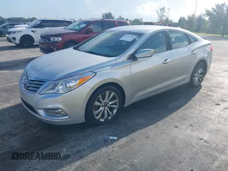 2014 Hyundai Azera z VIN KMHFG4JG9EA341354, wystawiony jako IAAI lot #42711386 z przebiegiem 144 157 mil mil oraz . Historia ofert i sprzedaży dostępna na DreamBid. Obrazek 2.