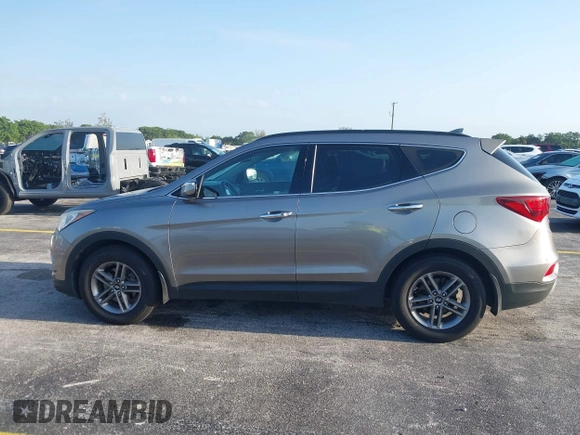 2017 Hyundai Santa Fe 2.4L z VIN 5XYZU3LB0HG420910, wystawiony jako IAAI lot #42017552 z przebiegiem 184 666 mil mil oraz . Historia ofert i sprzedaży dostępna na DreamBid. Obrazek 14.