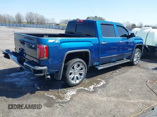2018 GMC Sierra 1500 SLT z VIN 3GTU2NEC8JG254323, wystawiony jako IAAI lot #41772180 z przebiegiem 157 143 mil mil oraz . Historia ofert i sprzedaży dostępna na DreamBid. Obrazek 4.