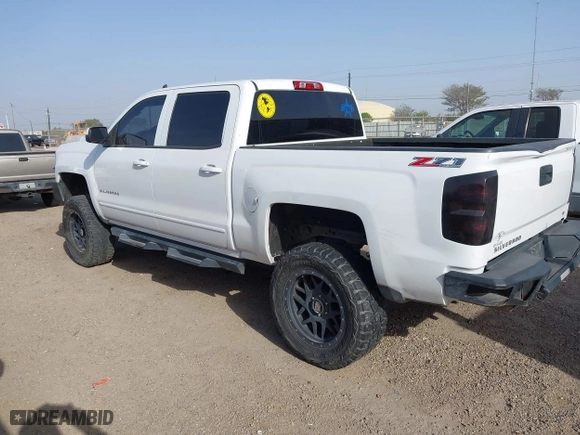 2015 Chevrolet Silverado 1500 LT with VIN 3GCUKREC1FG289851, listed as a IAAI auction lot 41676144 with 131,633 mi miles. Bid and sale history available at carsss.com. Image 3.