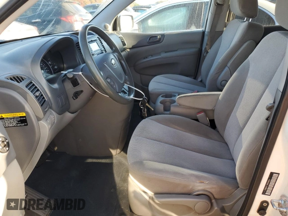 2011 Kia Sedona LX with VIN KNDMG4C76B6398313, listed as a Copart auction lot 77766494 with 244,988 mi miles and Salvage Title. Bid and sale history available at carsss.com. Image 7.