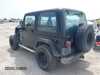 1999 Jeep Wrangler Sport z VIN 1J4FY19S0XP471848, wystawiony jako IAAI lot #42264563 z przebiegiem 280 121 mil mil oraz . Historia ofert i sprzedaży dostępna na DreamBid. Obrazek 3.