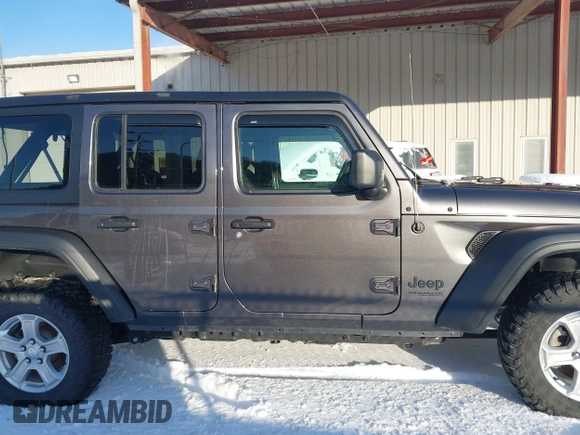 2022 Jeep Wrangler Unlimited Sport with VIN 1C4HJXDG5NW157317, listed as a IAAI auction lot 41374590 with 67,632 mi miles and . Bid and sale history available at DreamBid. Image 14.