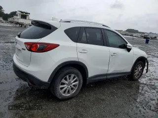 2016 Mazda CX-5 Touring z VIN JM3KE2CY5G0849288, wystawiony jako Copart lot #54594545 z przebiegiem 90 882 mil mil oraz Szkoda całkowita • Salvage title. Historia ofert i sprzedaży dostępna na DreamBid. Obrazek 3.