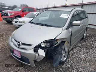2007 Mazda 5 Touring with VIN JM1CR29L570139627, listed as a IAAI auction lot 41153270 with 90,228 mi miles and . Bid and sale history available at carsss.com. Image 2.