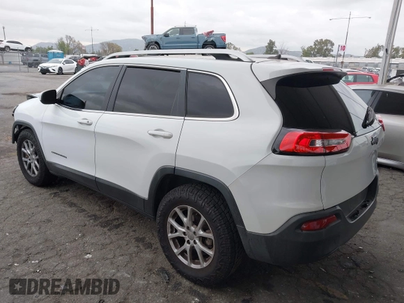 2015 Jeep Cherokee Latitude with VIN 1C4PJLCB5FW642701, listed as a IAAI auction lot 42063262 with 142,501 mi miles and . Bid and sale history available at carsss.com. Image 3.