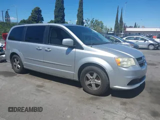 2012 Dodge Grand Caravan SXT with VIN 2C4RDGCG7CR204835, listed as a IAAI auction lot 41948688 with 125,466 mi miles and . Bid and sale history available at DreamBid. Image 1.