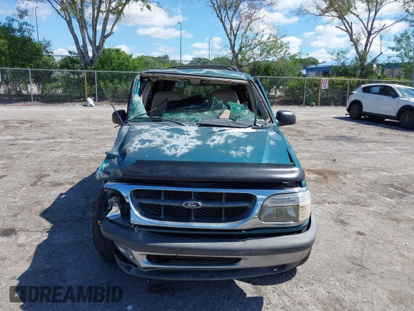 1998 Ford Explorer XLT z VIN 1FMZU32EXWUC84059, wystawiony jako IAAI lot #42260114 z przebiegiem 173 383 mil mil oraz . Historia ofert i sprzedaży dostępna na DreamBid. Obrazek 6.