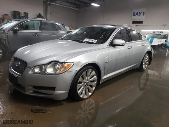 2009 Jaguar XF Premium Luxury with VIN SAJWA06B39HR03808, listed as a Copart auction lot 87085804 with 124635 miles and Salvage Title. Bid and sale history available at carsss.com. Image 1.