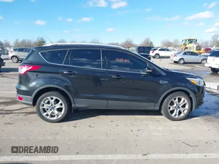 2015 Ford Escape Titanium with VIN 1FMCU0JX8FUC34459, listed as a IAAI auction lot 41394012 with 154,077 mi miles. Bid and sale history available at carsss.com. Image 13.