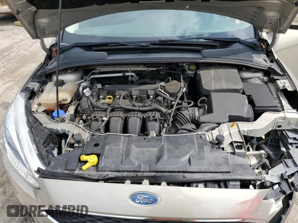2015 Ford Focus SE z VIN 1FADP3F29FL312757, wystawiony jako Copart lot #61198315 z przebiegiem 84 944 mil mil oraz Szkoda całkowita • Salvage title. Historia ofert i sprzedaży dostępna na DreamBid. Obrazek 11.