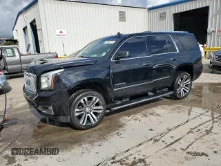 2017 GMC Yukon Denali with VIN 1GKS1CKJ7HR261831, listed as a Copart auction lot 79091724 with 156,082 mi miles and Salvage Title. Bid and sale history available at carsss.com. Image 1.